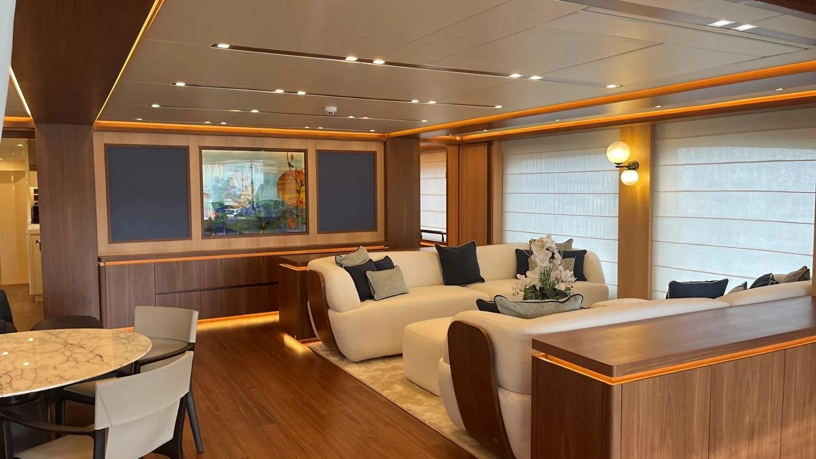 The salon features a spacious seating area with modern decor and ample natural light. aboard LADY BETTY Yacht for Sale