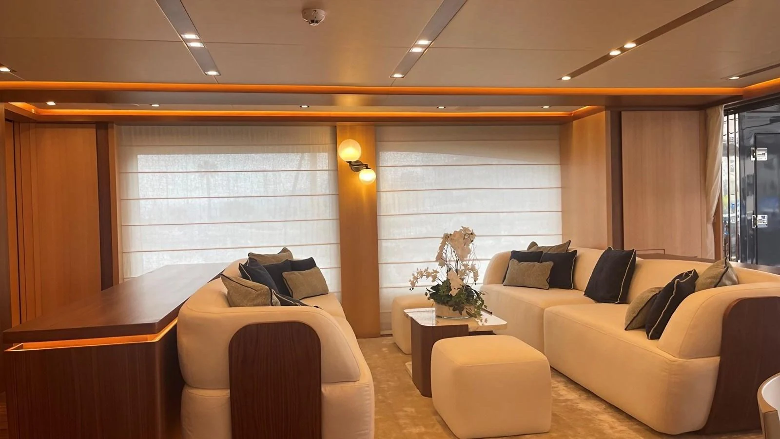 The salon features plush seating, warm lighting, and elegant decor for a comfortable and stylish retreat. aboard LADY BETTY Yacht for Sale