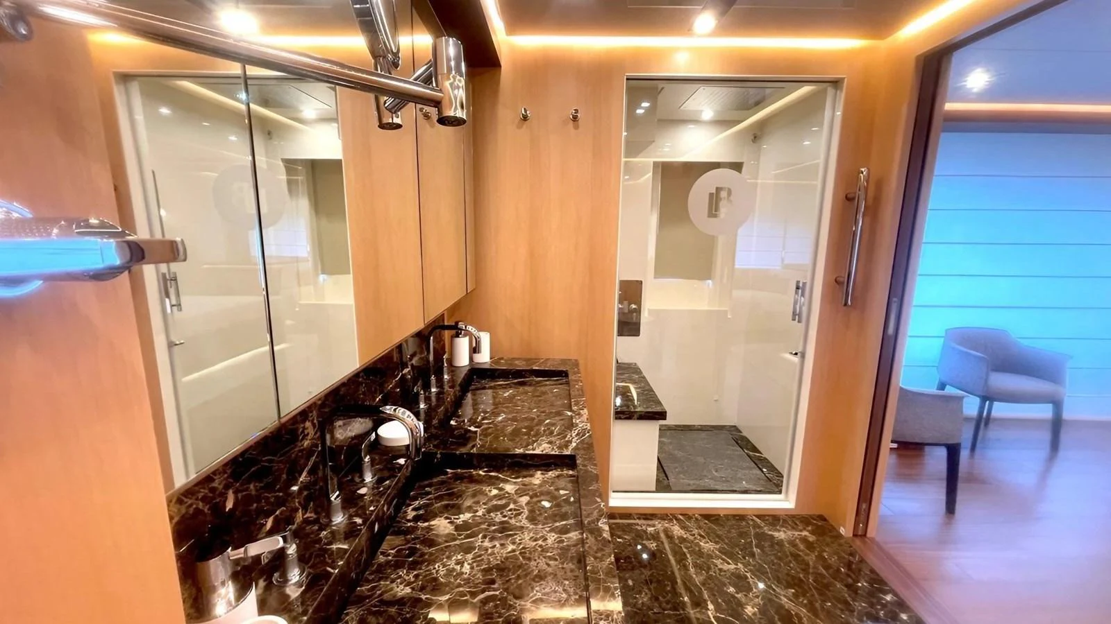 The yacht's bathroom features luxurious marble countertops and modern fixtures. aboard LADY BETTY Yacht for Sale