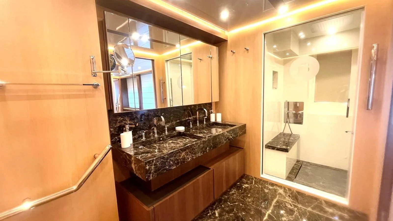 The yacht's bathroom features luxurious marble countertops and a spacious shower area. aboard LADY BETTY Yacht for Sale