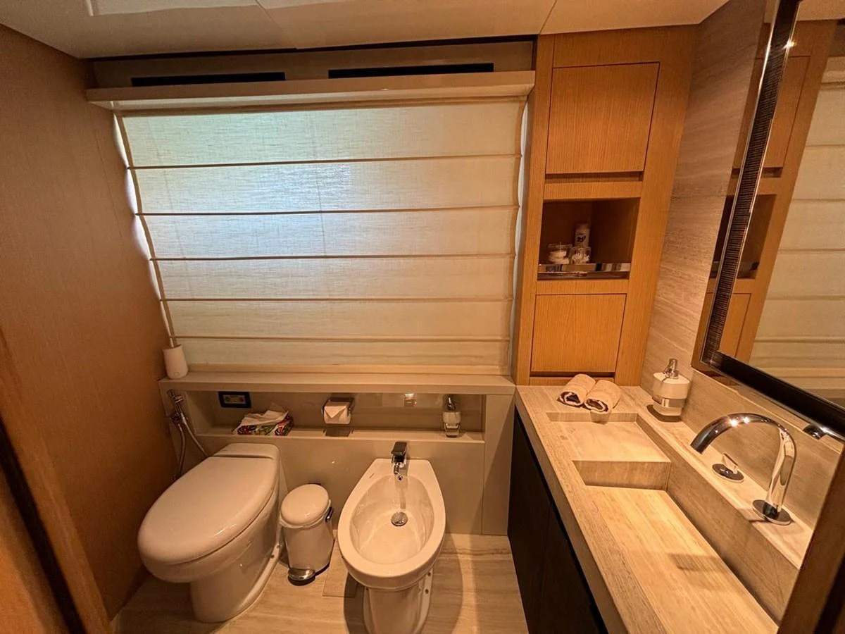 A well-appointed yacht bathroom with modern fixtures and wooden accents. aboard SL94 Yacht for Sale