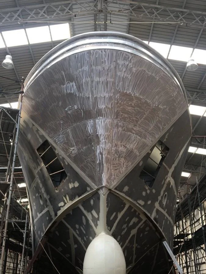 The yacht is shown in a shipyard, undergoing maintenance or construction. aboard WIDESPACE EXPLORER Yacht for Sale