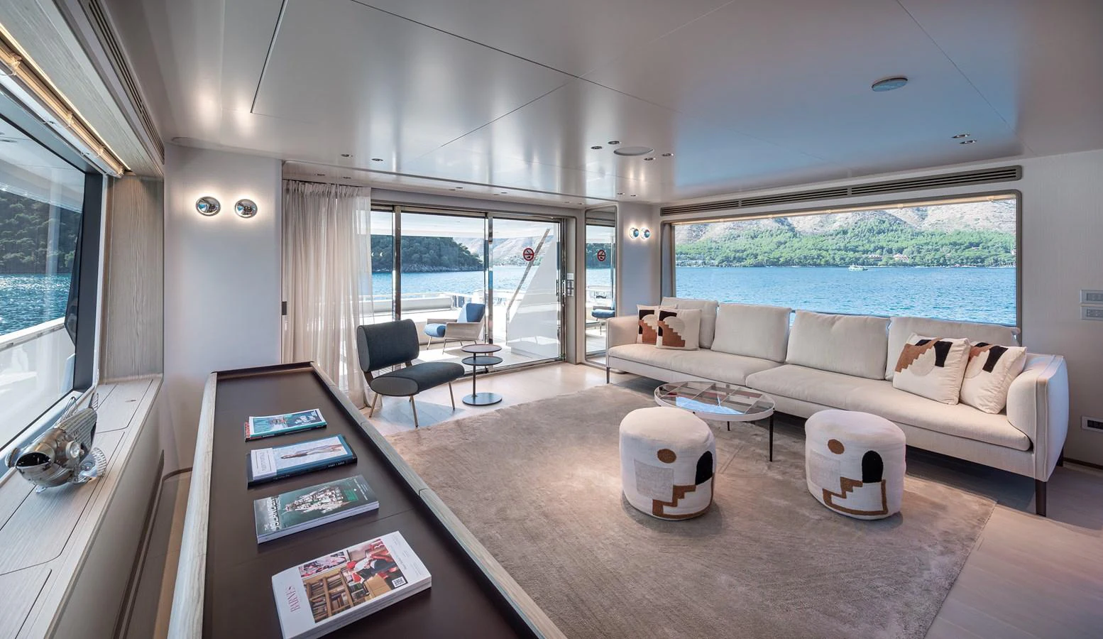 The spacious salon offers a luxurious and comfortable setting with panoramic views of the surrounding waters. aboard BELLE ILE Yacht for Sale