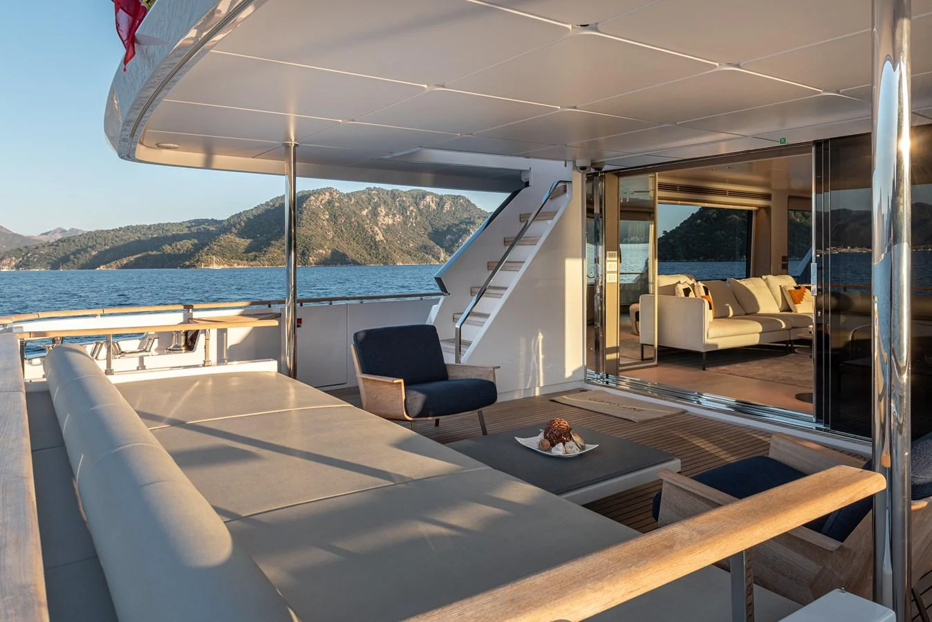 The aft deck offers a spacious and inviting area with comfortable seating and stunning views of the surrounding waters. aboard BELLE ILE Yacht for Sale