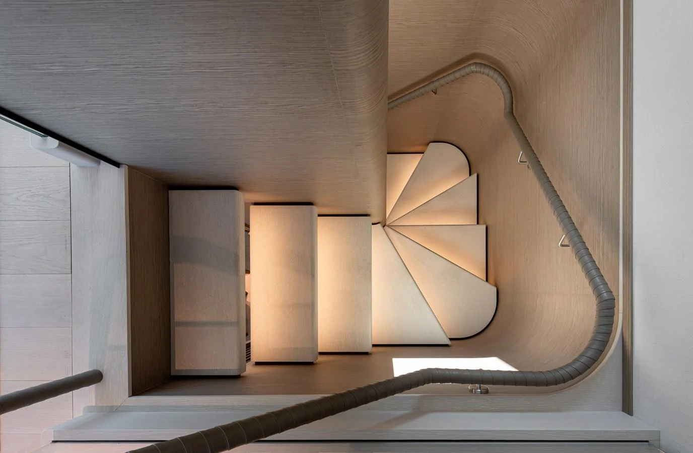 A beautifully designed staircase with elegant lighting and modern finishes. aboard BELLE ILE Yacht for Sale