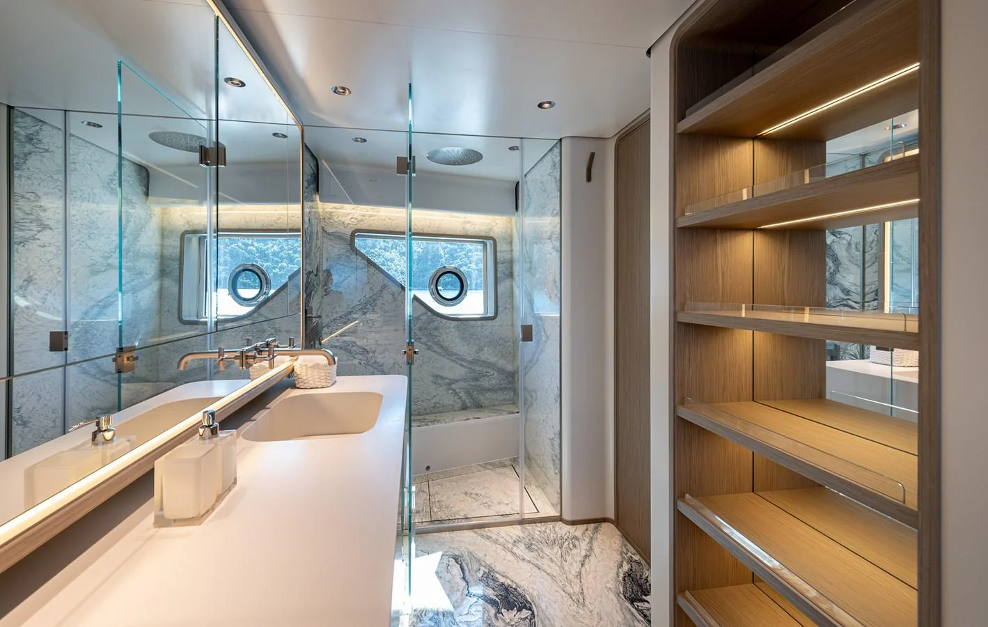 The yacht's bathroom features modern fixtures, ample storage, and elegant marble accents. aboard BELLE ILE Yacht for Sale