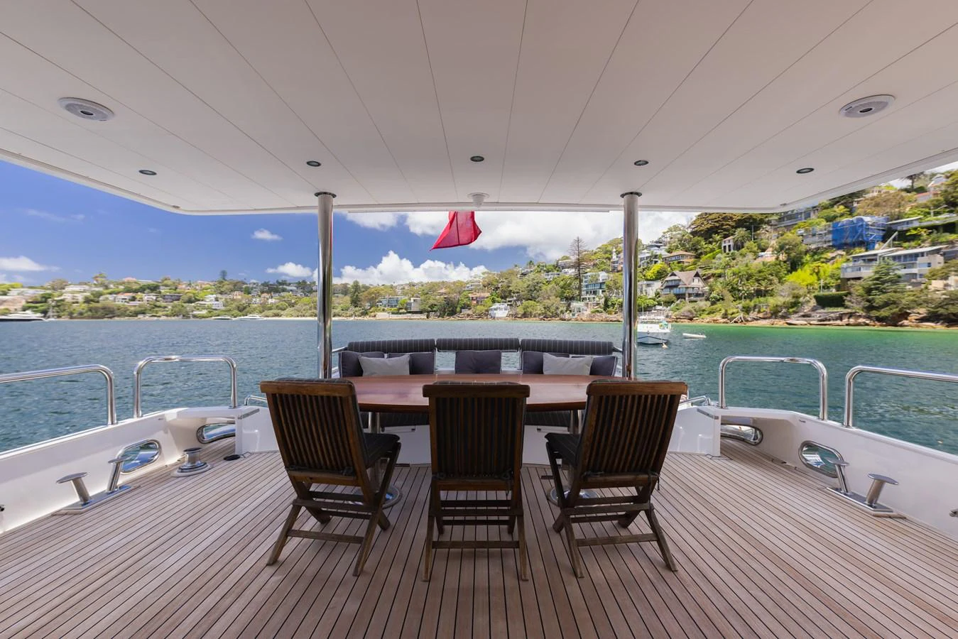 The aft deck offers a spacious and inviting area for outdoor dining and relaxation with stunning views. aboard SASSY Yacht for Sale