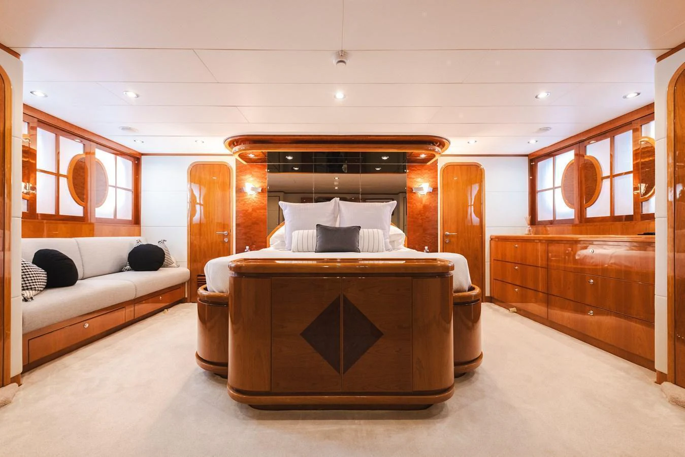 The master stateroom features luxurious wood finishes and ample natural light. aboard SASSY Yacht for Sale