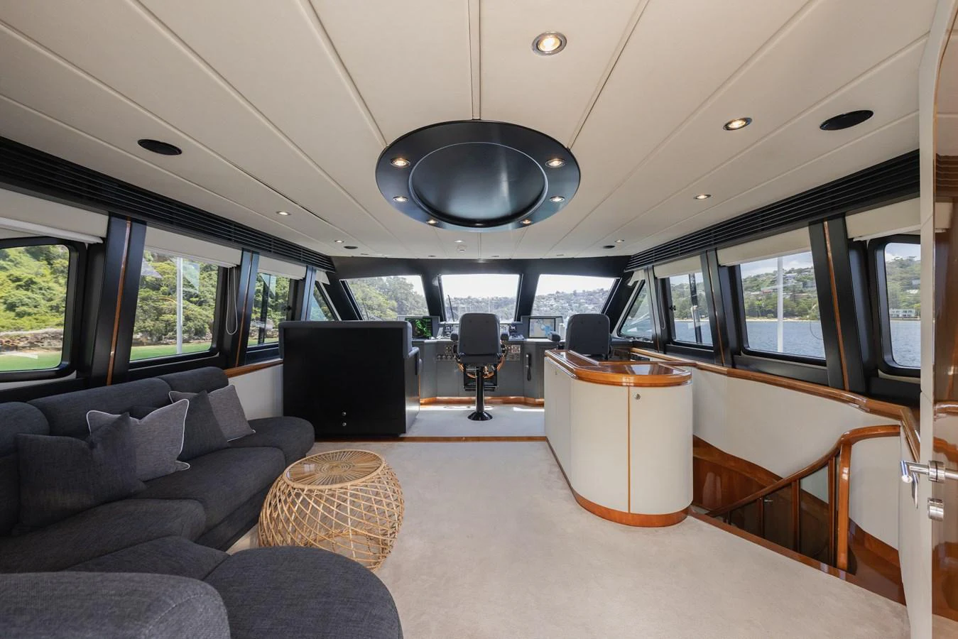 The spacious salon offers panoramic views and luxurious seating. aboard SASSY Yacht for Sale