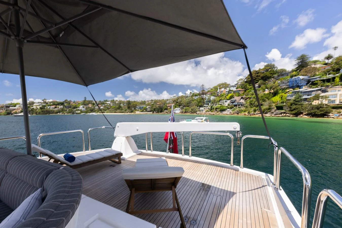 The aft deck offers a relaxing space with comfortable seating and a stunning view of the surrounding waters and coastline. aboard SASSY Yacht for Sale