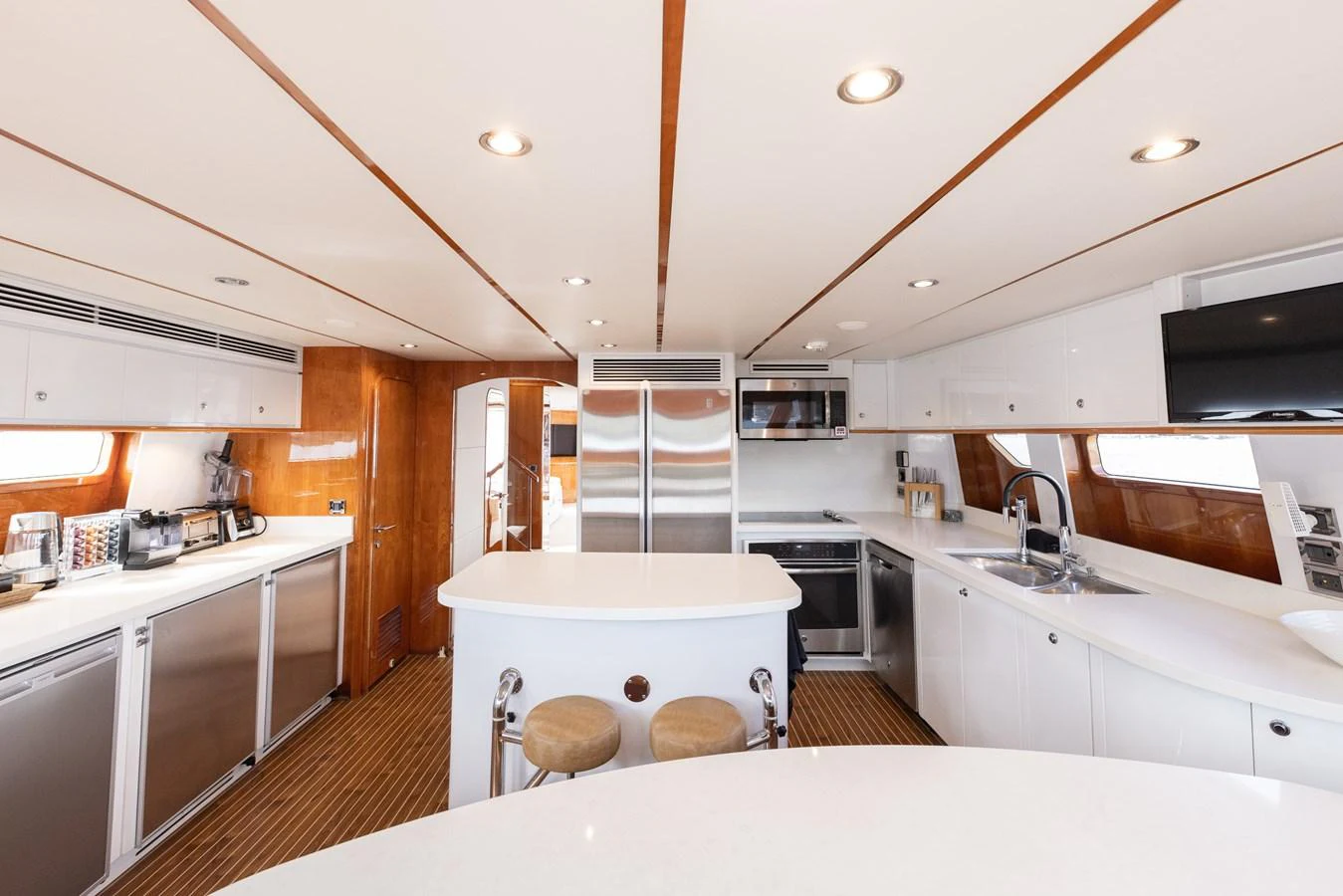 The yacht's galley features modern appliances and ample counter space, creating a perfect environment for gourmet cooking. aboard SASSY Yacht for Sale