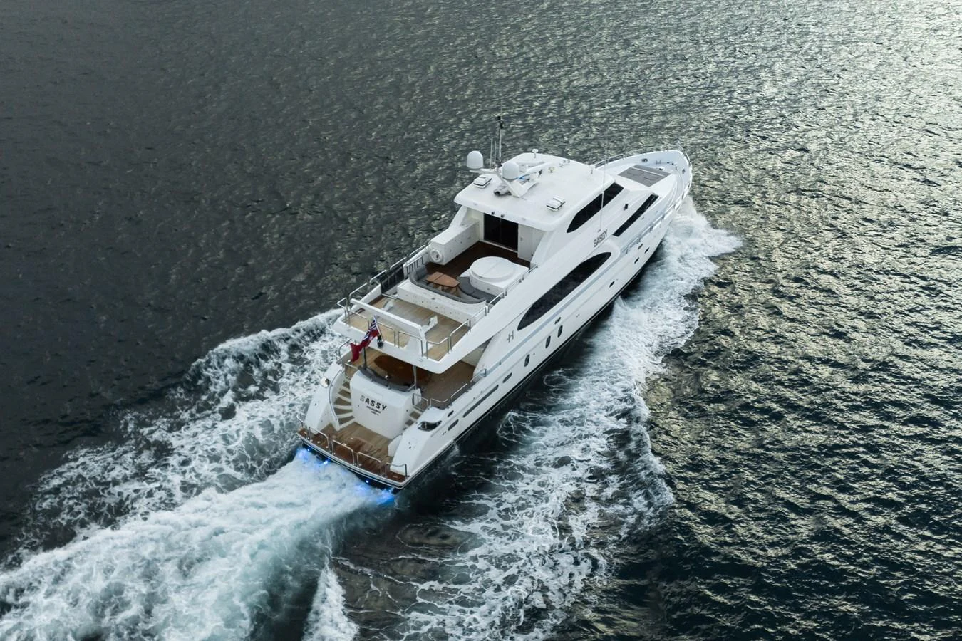 A luxurious yacht cruises through the open water, showcasing its sleek design and spacious decks. aboard SASSY Yacht for Sale