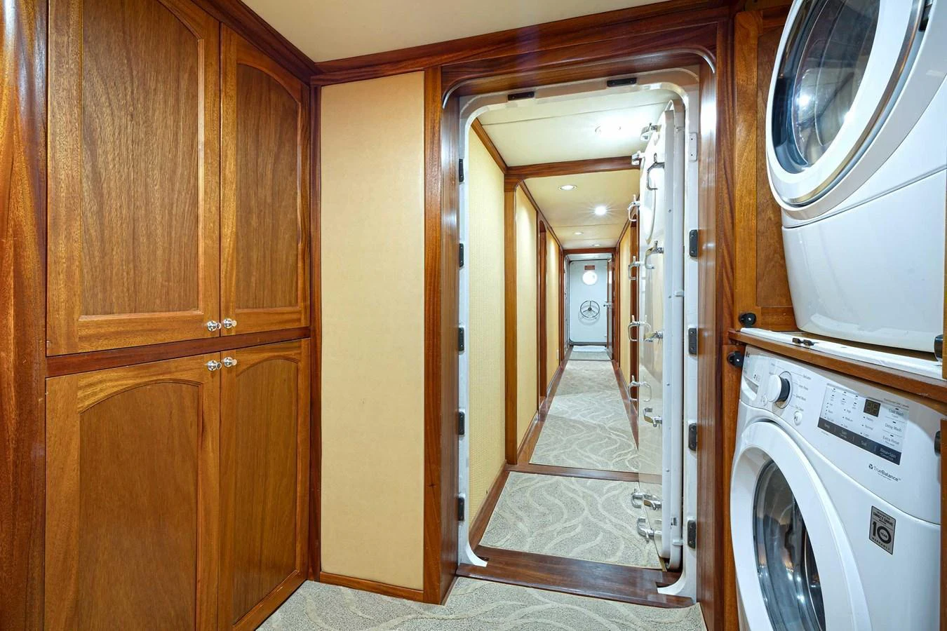 The yacht's interior features a well-equipped laundry area with modern appliances and ample storage. aboard HEAVEN'S GATE Yacht for Sale