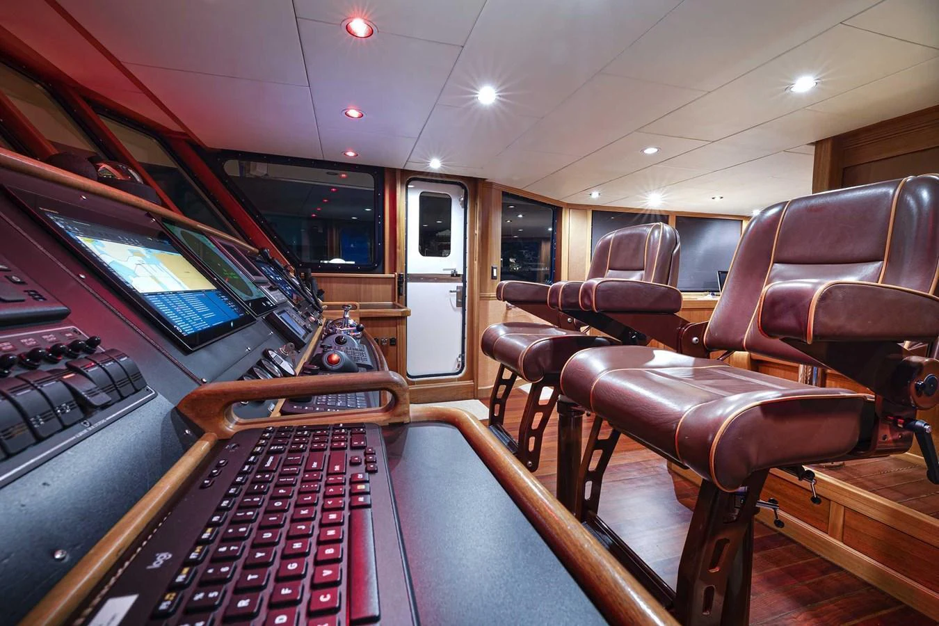 The helm station features state-of-the-art navigation equipment and luxurious leather seating. aboard HEAVEN'S GATE Yacht for Sale