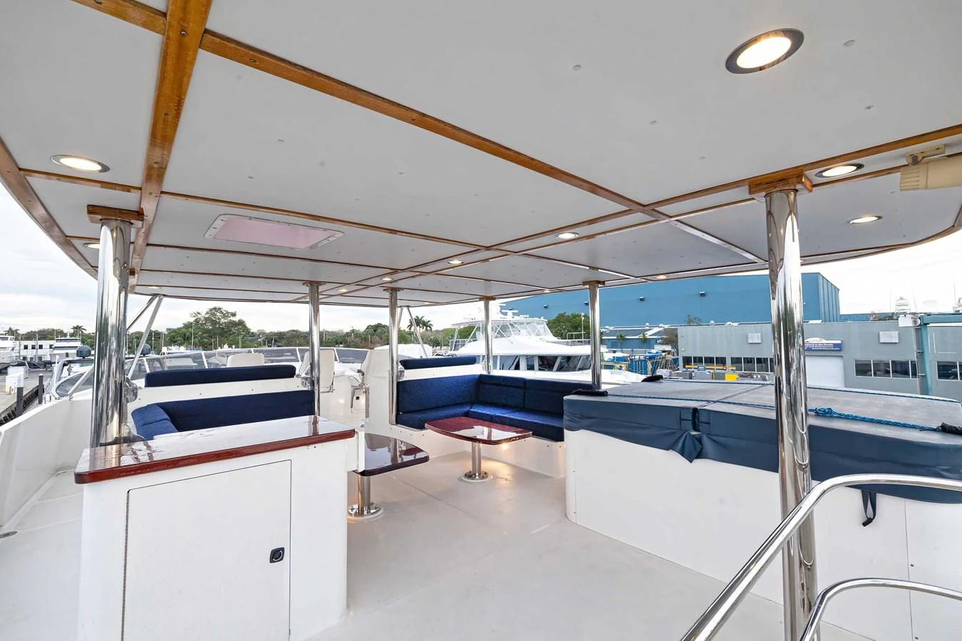 The flybridge offers a spacious and comfortable seating area with ample natural light. aboard HEAVEN'S GATE Yacht for Sale