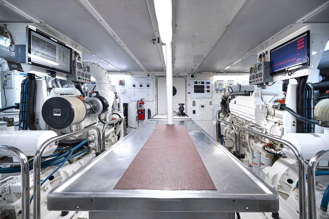The engine room is meticulously organized, showcasing advanced machinery and control panels. aboard HEAVEN'S GATE Yacht for Sale