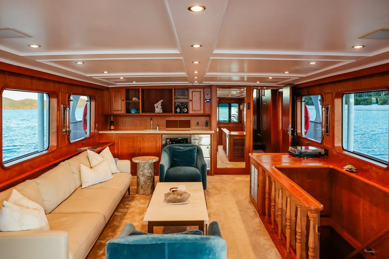 The salon features a spacious and inviting seating area with large windows offering stunning ocean views. aboard VICTORIA Yacht for Sale