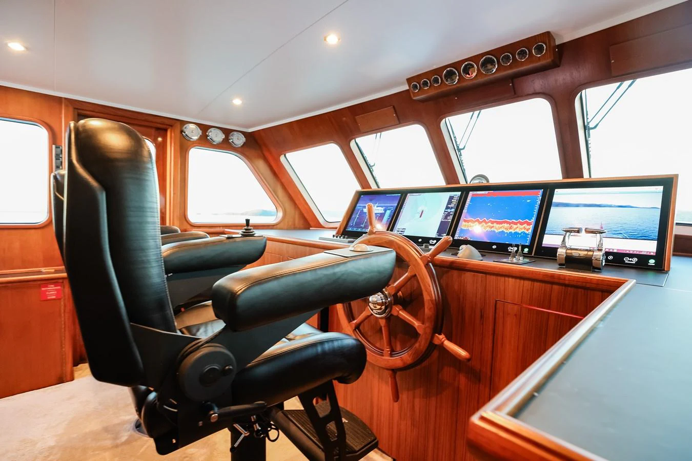The helm features advanced navigation equipment and luxurious seating for the captain. aboard VICTORIA Yacht for Sale