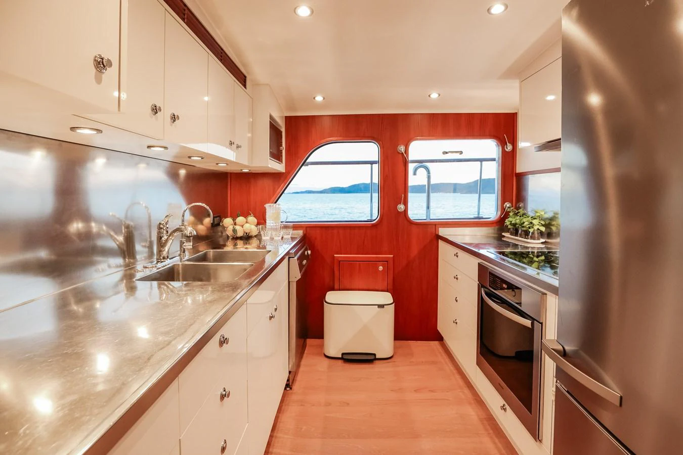 The yacht's galley is equipped with modern appliances and offers a stunning view of the sea through its windows. aboard VICTORIA Yacht for Sale