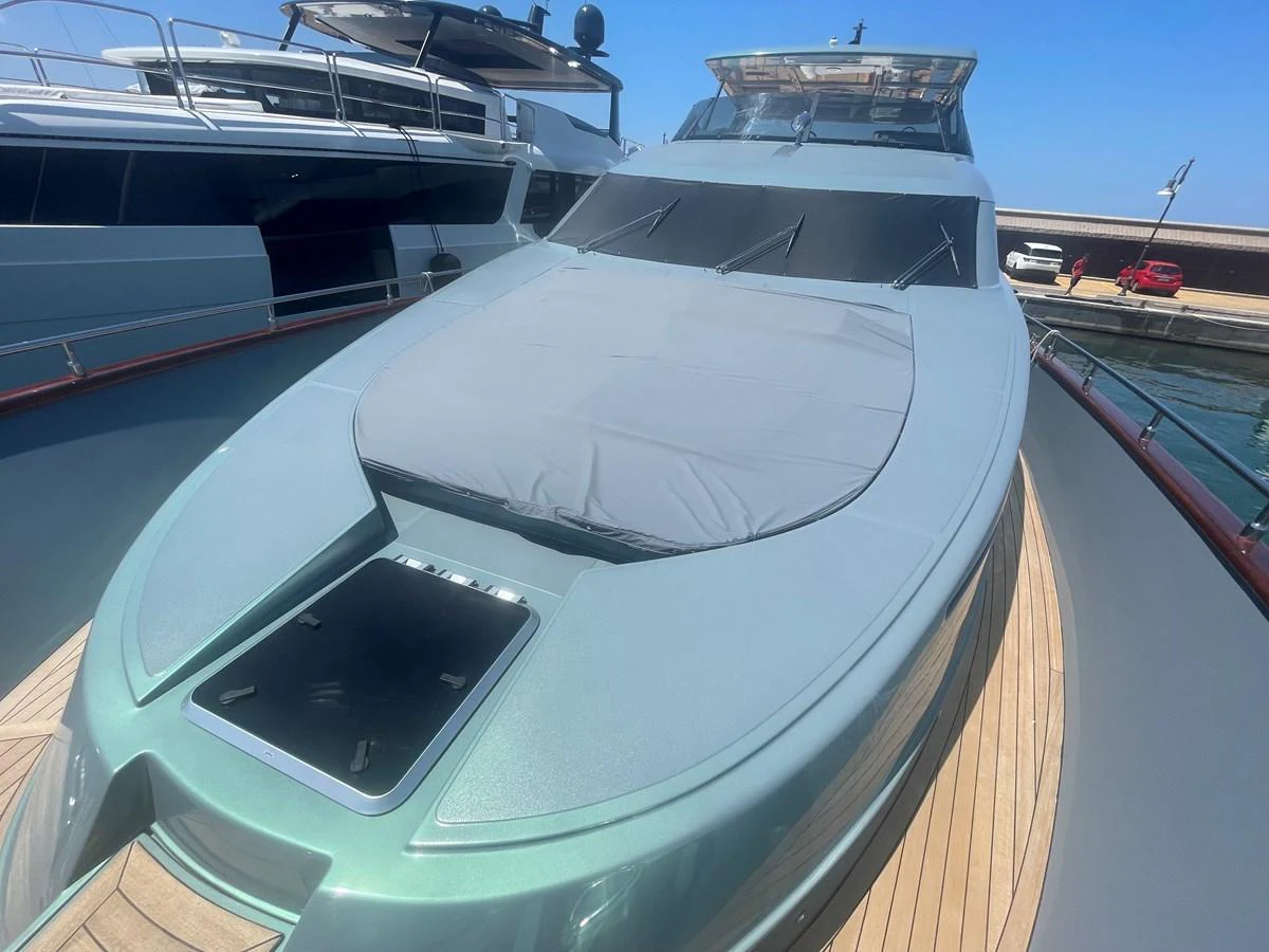 The yacht's sleek exterior features a spacious foredeck with a sunpad, perfect for relaxation. aboard UNICA Yacht for Sale