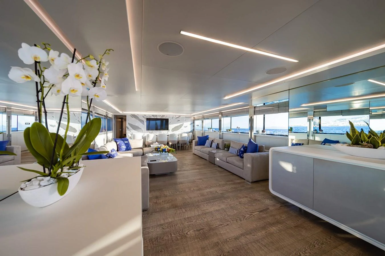 The spacious salon features modern decor with ample seating and large windows for natural light. aboard BARENTS SEA Yacht for Sale