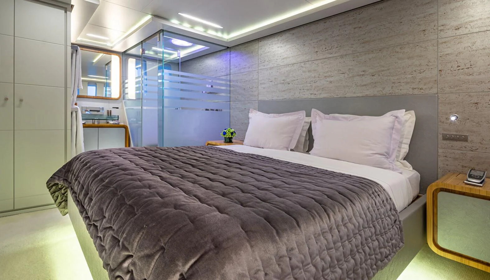 A luxurious stateroom featuring a plush bed and modern design elements. aboard BARENTS SEA Yacht for Sale