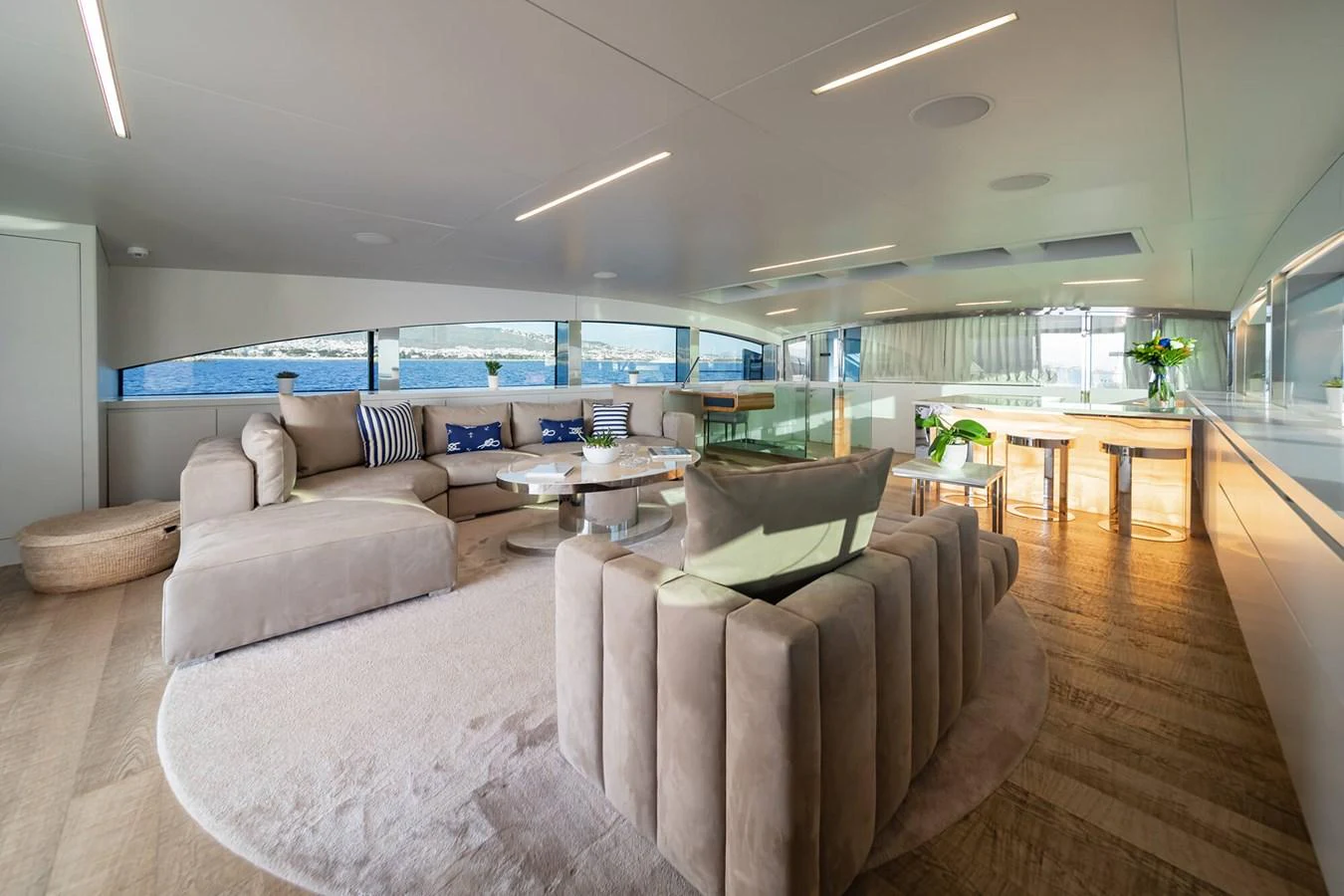 The salon offers a spacious and luxurious seating area with panoramic views of the sea. aboard BARENTS SEA Yacht for Sale