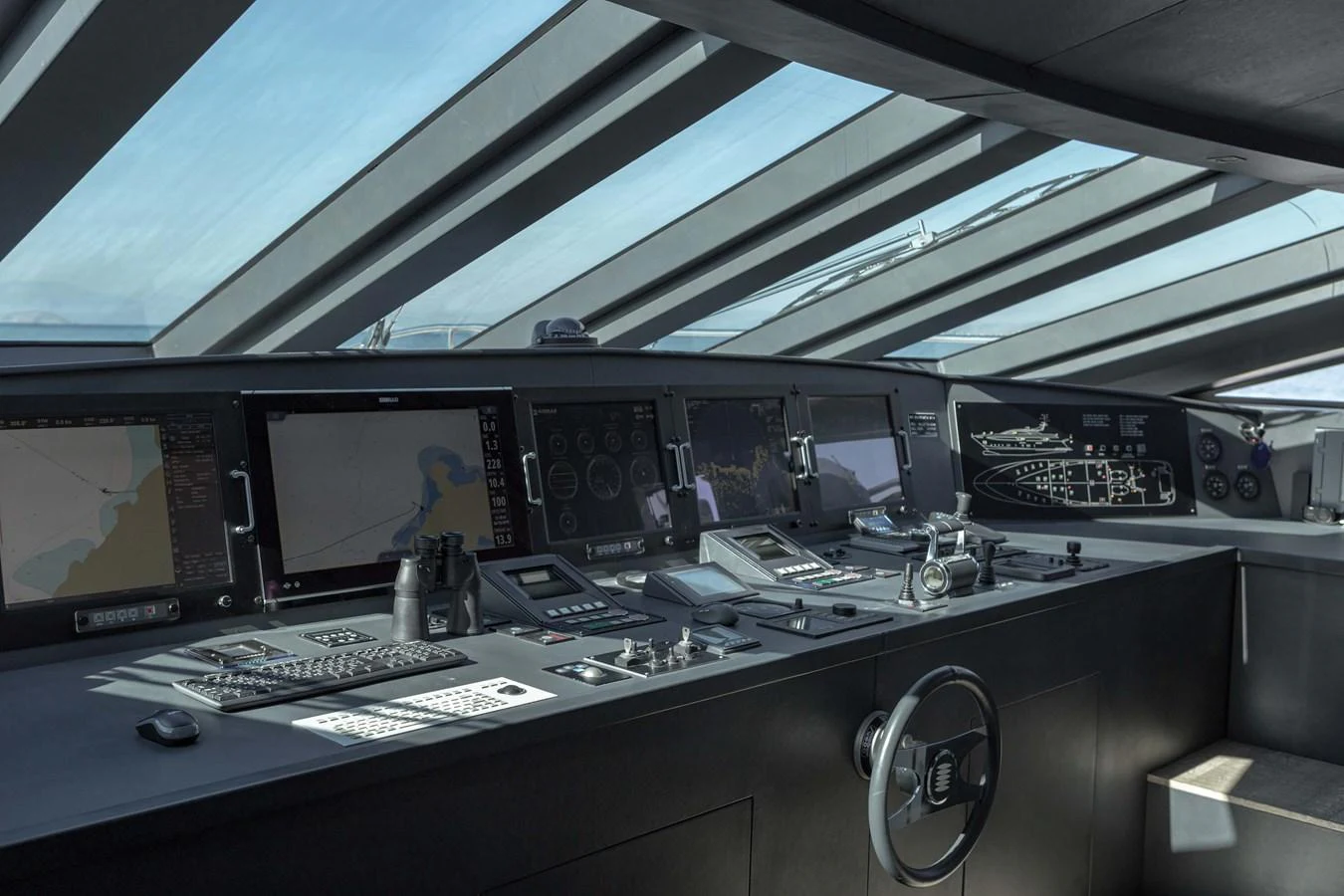 The helm station features advanced navigation equipment and a sleek, modern design. aboard BARENTS SEA Yacht for Sale