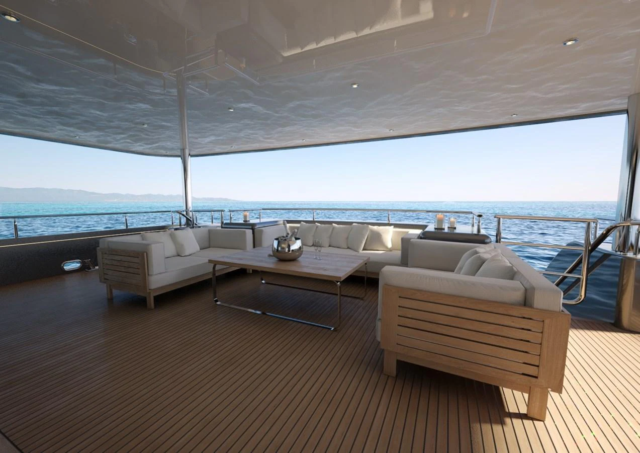 The aft deck features a spacious seating area with comfortable sofas and a stunning ocean view. aboard MAGNOLIA II Yacht for Sale