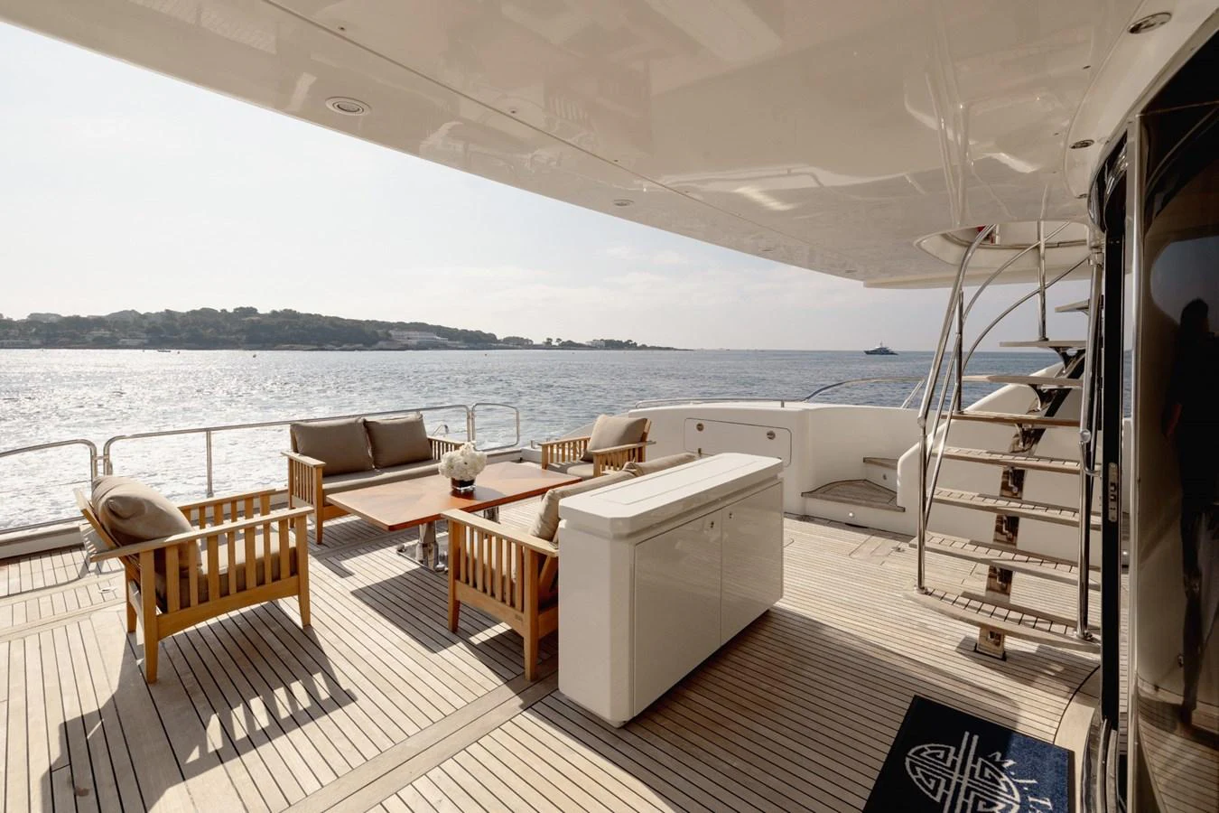 The aft deck offers a spacious and inviting area for relaxation with comfortable seating and stunning sea views. aboard M.J. TAKNM Yacht for Sale
