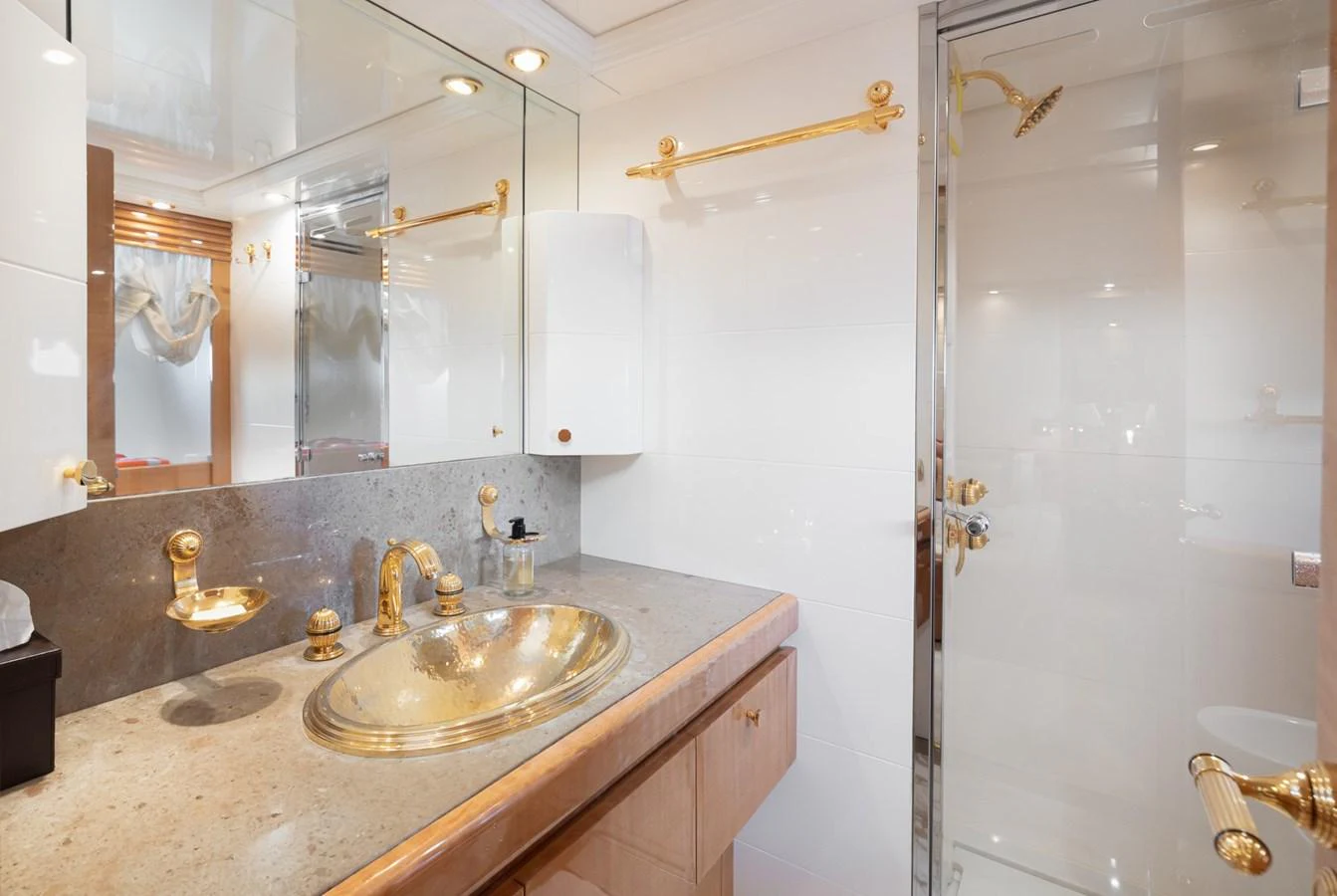 The yacht's bathroom features elegant fixtures and a spacious shower area. aboard M.J. TAKNM Yacht for Sale