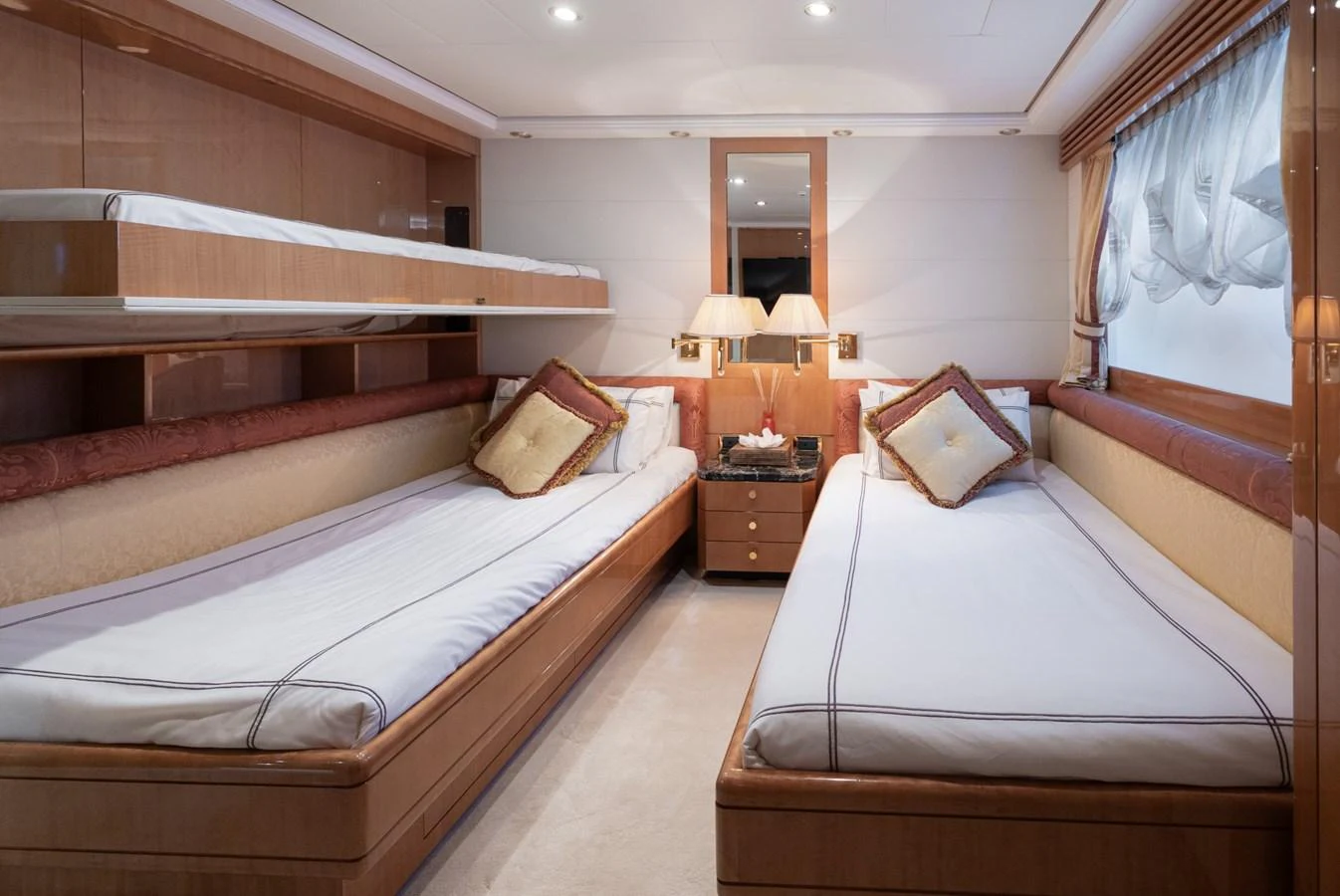 The twin stateroom offers a cozy and elegant sleeping area with two single beds and tasteful decor. aboard M.J. TAKNM Yacht for Sale