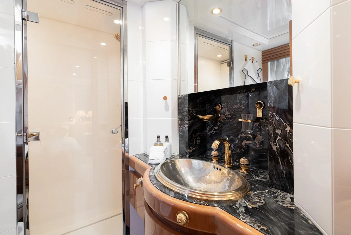 The yacht's bathroom features elegant fixtures and luxurious finishes. aboard M.J. TAKNM Yacht for Sale