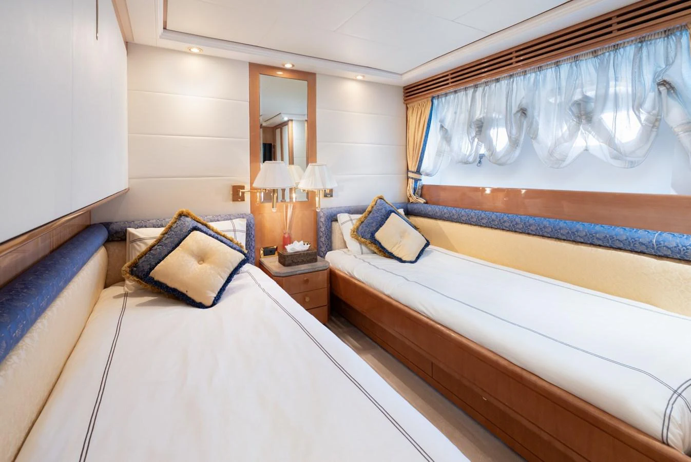 The twin stateroom offers a cozy and elegant sleeping area with two single beds and tasteful decor. aboard M.J. TAKNM Yacht for Sale