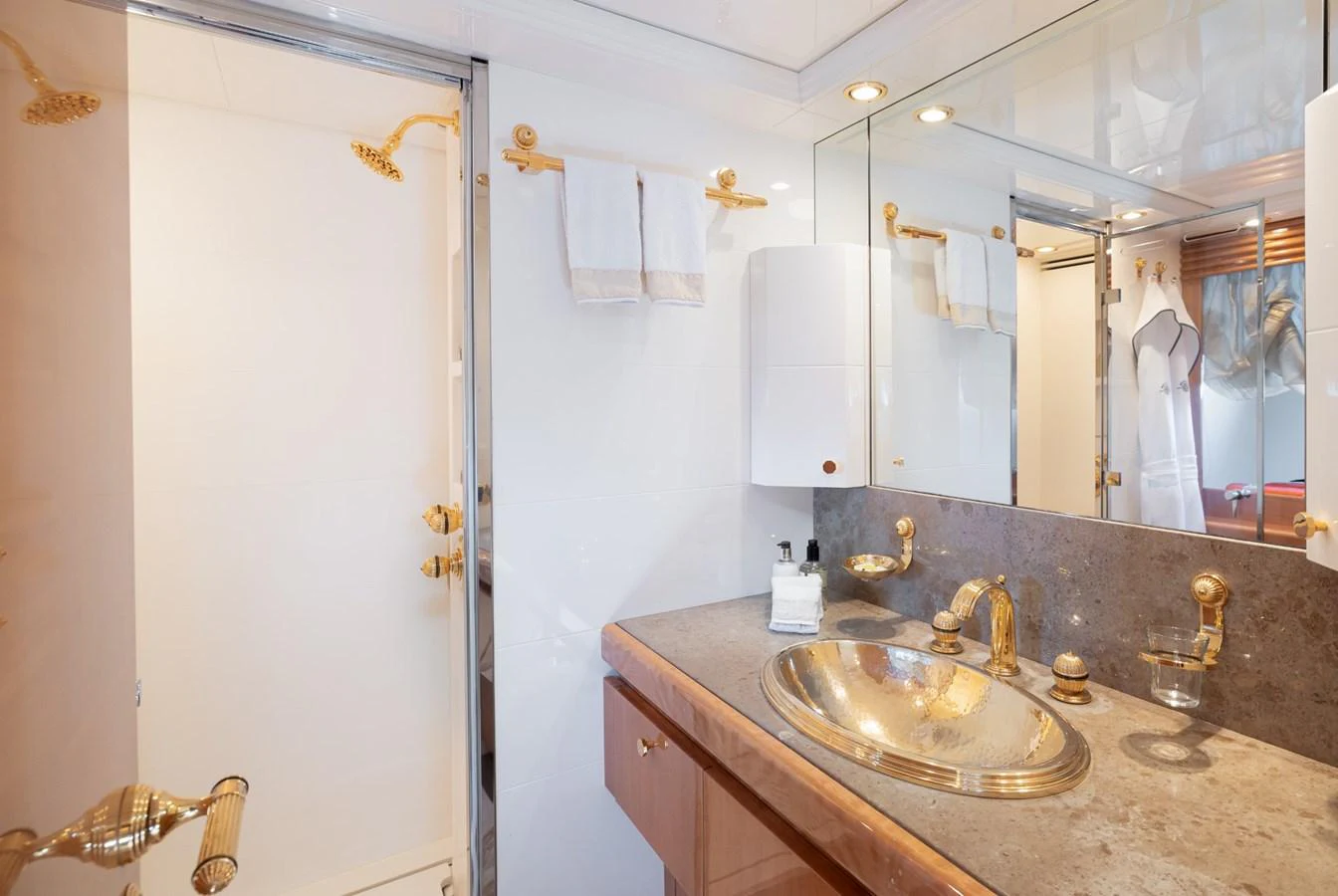 The yacht's bathroom features elegant fixtures and a luxurious design. aboard M.J. TAKNM Yacht for Sale
