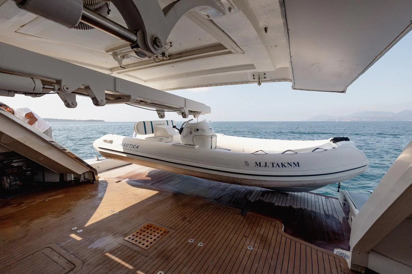 A sleek tender is stored on the yacht's deck, ready for deployment into the water. aboard M.J. TAKNM Yacht for Sale