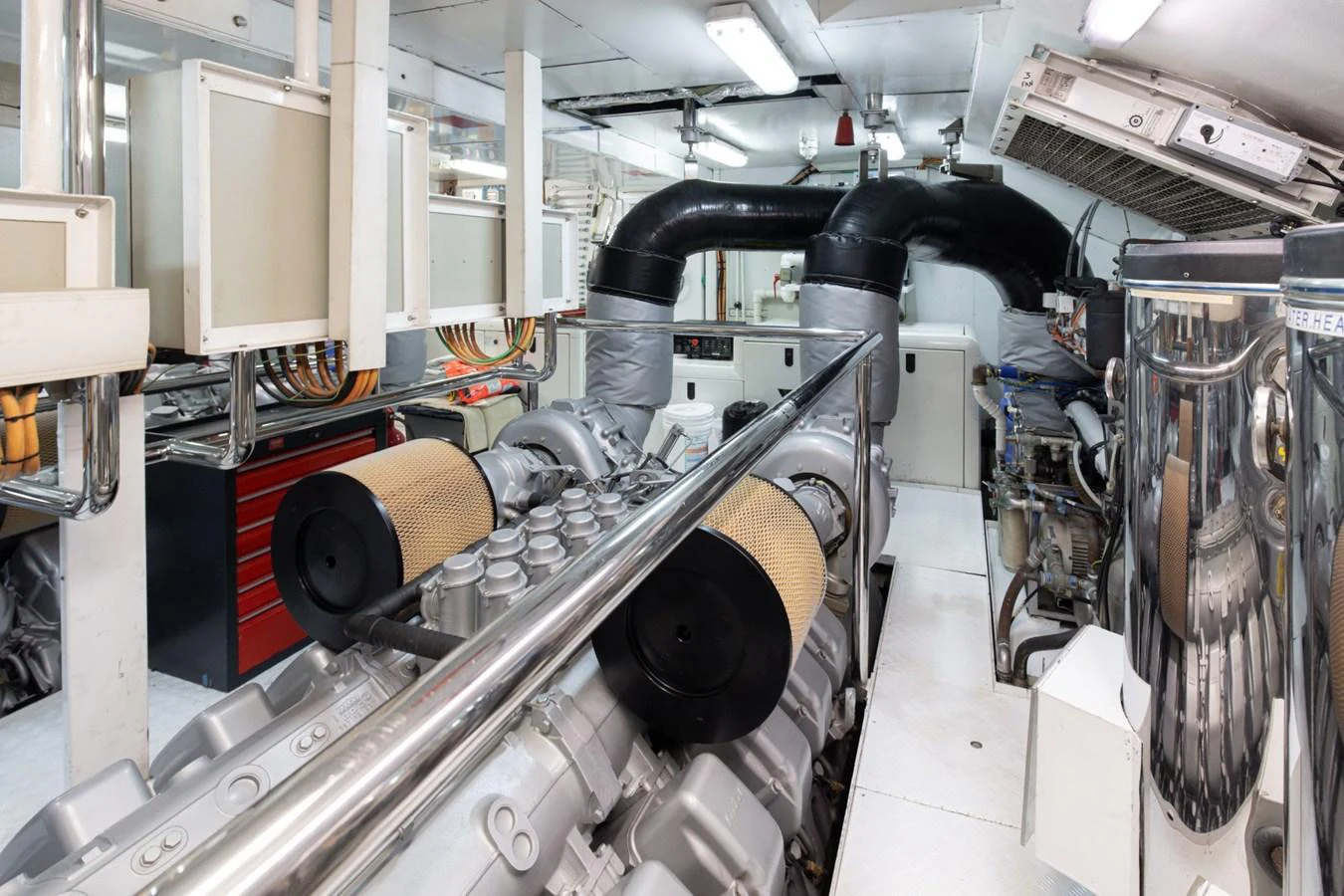 The image showcases the yacht's well-maintained engine room with advanced machinery and equipment. aboard M.J. TAKNM Yacht for Sale