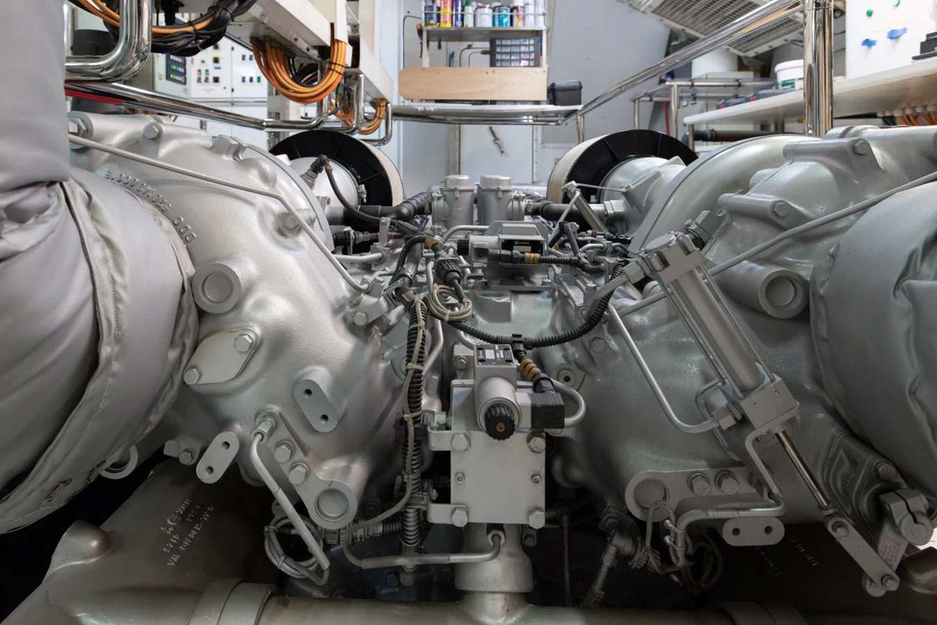 The image showcases the intricate and powerful engine room of the yacht, highlighting its advanced mechanical systems. aboard M.J. TAKNM Yacht for Sale