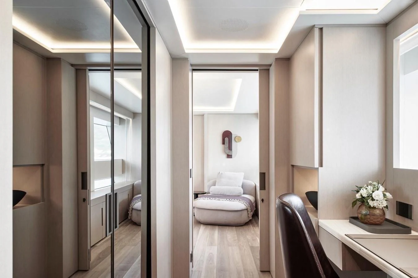 The yacht's stateroom features a modern design with a comfortable seating area and elegant decor. aboard ATTITUDE Yacht for Sale