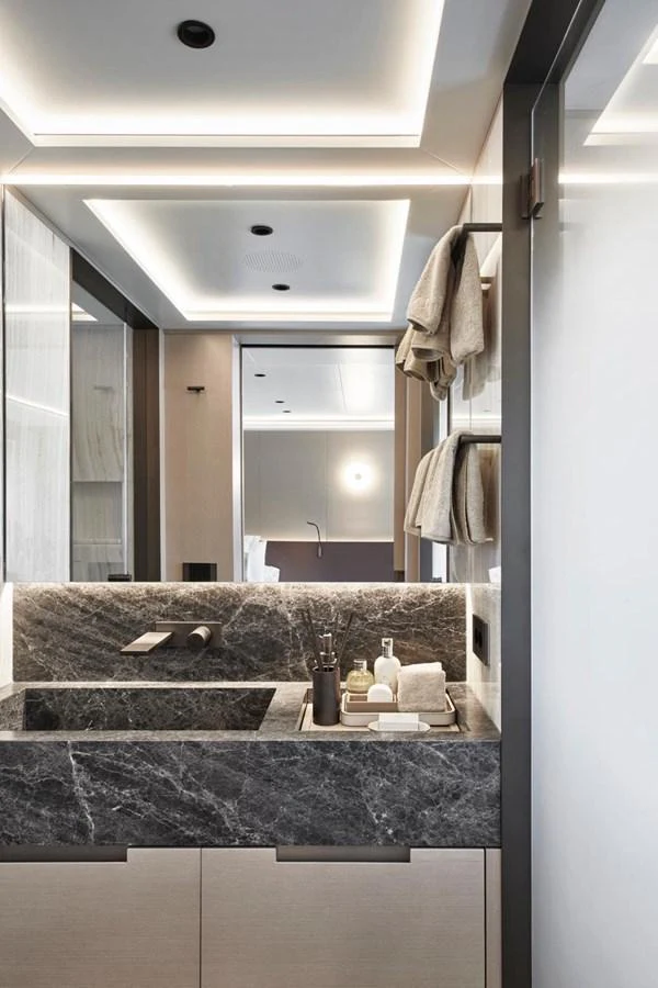 A luxurious yacht bathroom with modern fixtures and elegant marble accents. aboard ATTITUDE Yacht for Sale