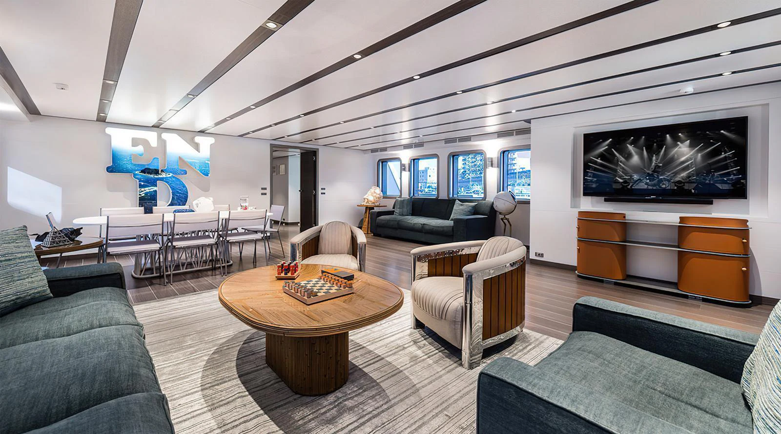 The yacht's salon features a spacious and modern design with ample seating and entertainment options. aboard EXPLORER 130 Yacht for Sale