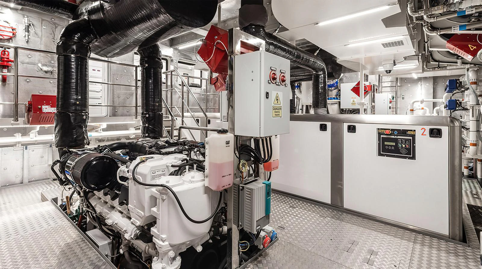 The engine room showcases advanced machinery and a meticulously organized layout. aboard EXPLORER 130 Yacht for Sale