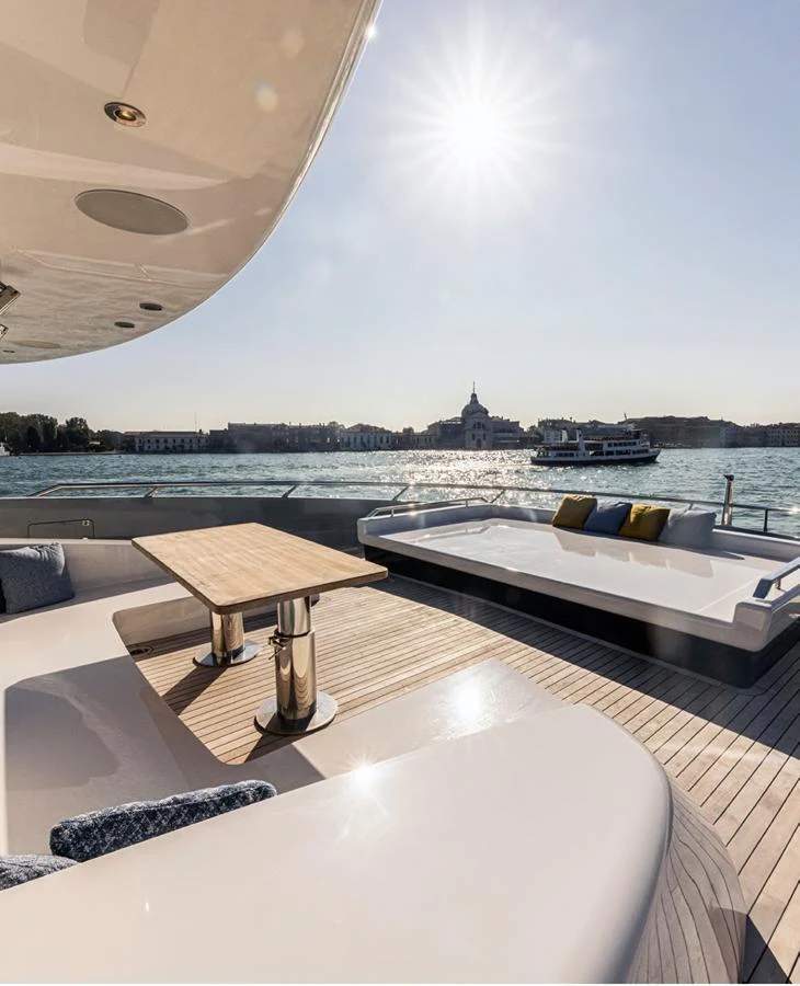 The aft deck offers a luxurious seating area with a stunning view of the water. aboard DOGE 500 Yacht for Sale