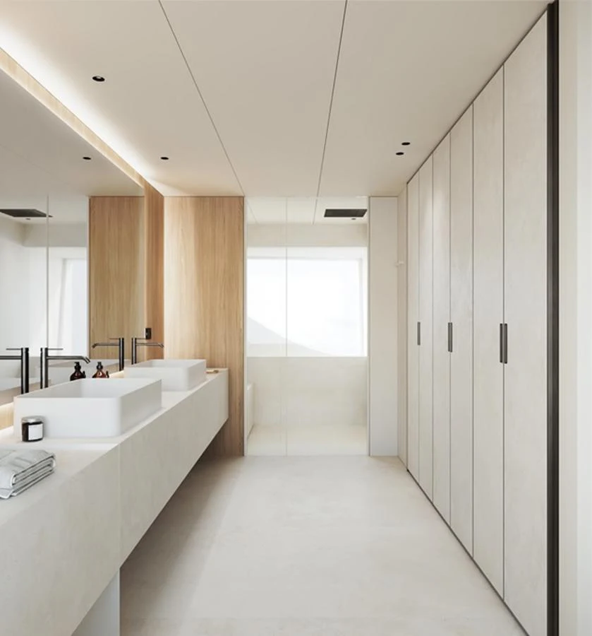 The yacht's bathroom features a sleek, modern design with dual sinks and ample storage. aboard DOGE 500 Yacht for Sale