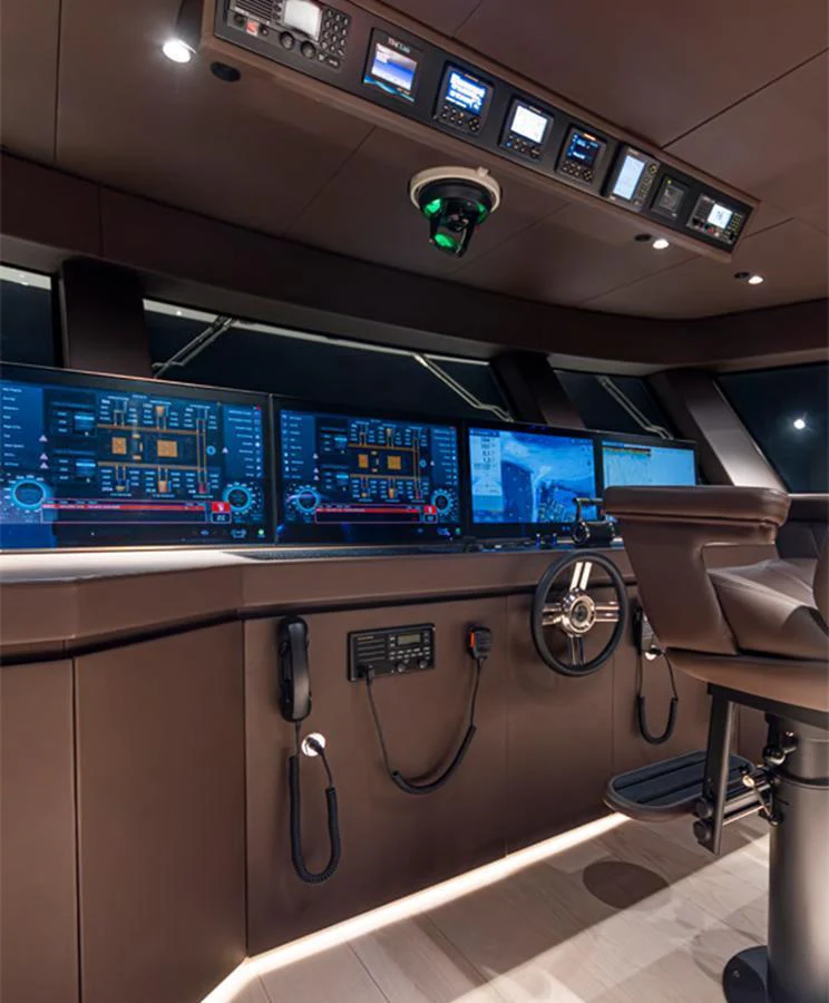 The helm station is equipped with advanced navigation systems and luxurious seating. aboard DOGE 500 Yacht for Sale