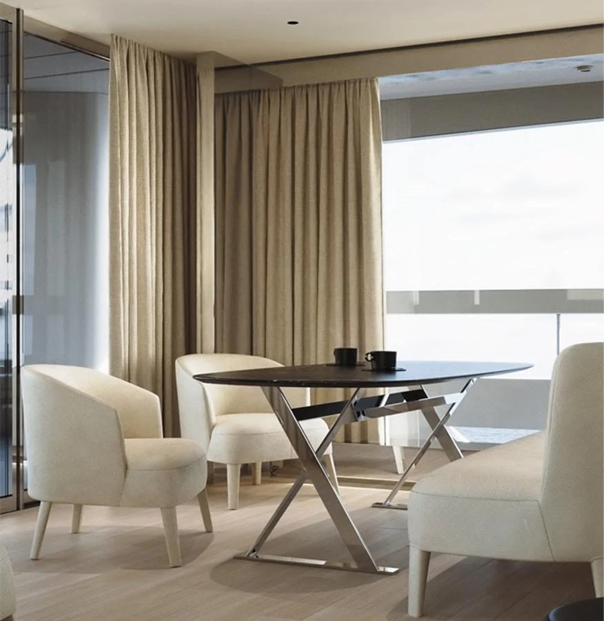 A serene and modern interior dining area with elegant furnishings and ample natural light. aboard DOGE 500 Yacht for Sale