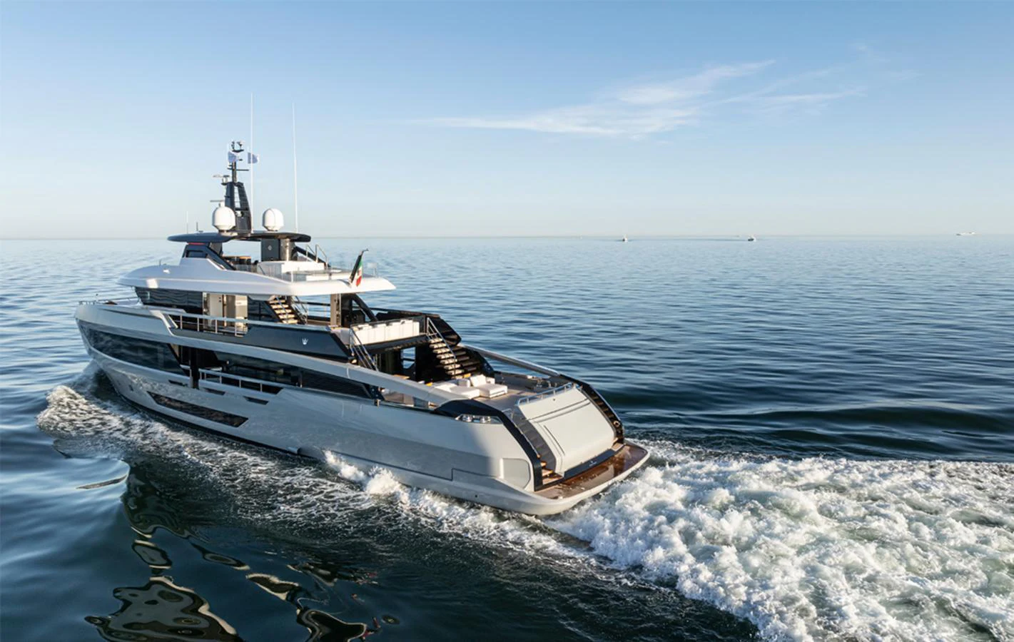 A sleek and modern yacht glides effortlessly over calm waters, showcasing its elegant design and luxurious amenities. aboard DOGE 500 Yacht for Sale