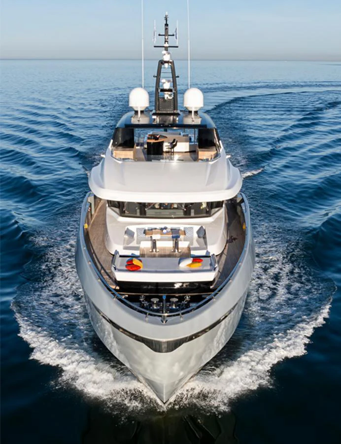A sleek and modern yacht cruises through calm waters, showcasing its elegant design and luxurious amenities. aboard DOGE 500 Yacht for Sale