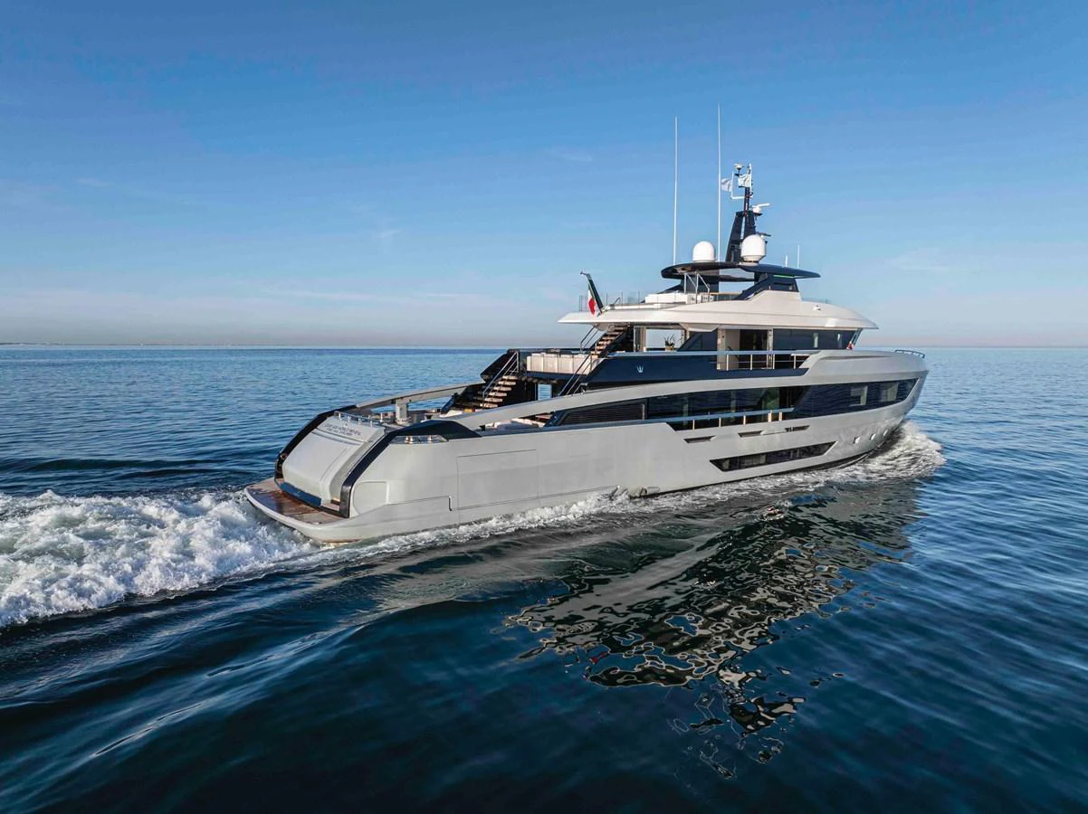 A sleek and modern yacht cruises smoothly on calm waters under a clear blue sky. aboard DOGE 500 Yacht for Sale