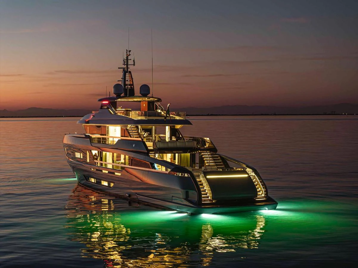 A stunning yacht illuminated at dusk, showcasing its sleek design and elegant lighting. aboard DOGE 500 Yacht for Sale